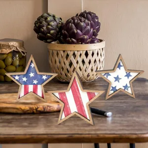 Rustic wooden star tabletop decorations with American flag red white and blue patriotic theme.