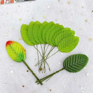 Close-up detail of artificial wire leaves, green leaf accessories for DIY handmade garlands.