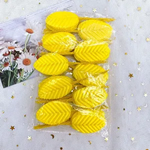 Detailed view of yellow artificial wire leaves for DIY handmade floral garlands and crafts.