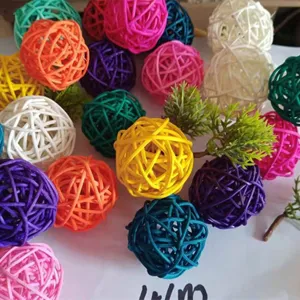 Close-up detail shot of colorful rattan wicker balls, perfect bird parrot toys for chewing.