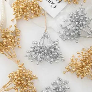 Artificial Christmas berry stems, gold and silver floral branch decorations for DIY wreaths.