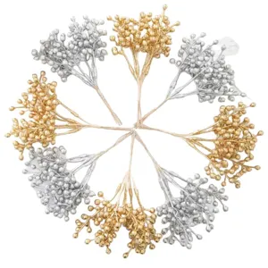Artificial golden and silver berry stems for Christmas wreath and tree decoration crafts.