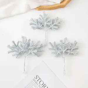 Silver glitter artificial pine branches for Christmas tree decoration, wreath and craft DIY.