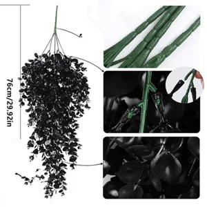Close-up details of black artificial eucalyptus hanging vine, showing stem texture and leaves.