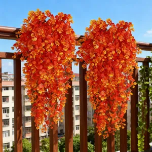Artificial autumn eucalyptus hanging vines, vibrant orange plastic plant for indoor outdoor decor.