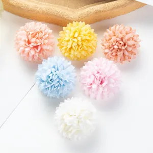 Close-up of colorful artificial hydrangea flower heads for DIY crafts and home decor detailing.