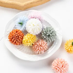 Artificial flower heads detail view showing vibrant colorful silk chrysanthemums for DIY crafts.