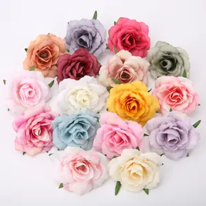 Close-up details of assorted artificial flower heads, vibrant colors for DIY crafts and decor.