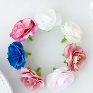 Artificial silk rose flower heads for DIY crafts, wedding decoration, and floral arrangements.