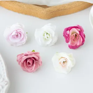 Close-up view of colorful artificial silk rose flower heads, perfect for DIY crafts and decor.