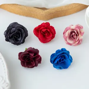 Artificial rose flower heads detail view, vibrant colors set for DIY crafts and wedding decor.