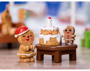 Christmas gingerbread man miniature resin ornament set for desktop decor and DIY snow scenes.