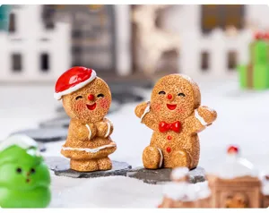 Christmas gingerbread man figurines set, cute resin mini desktop ornaments for holiday decor detail.