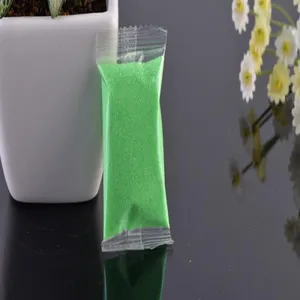 Green colored sand for micro landscape glass bottles, perfect gardening stone decoration detail.