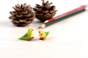 Close-up detail of cute resin parrot miniature figurines, perfect for DIY landscape decor.