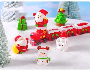 Detailed close-up shot of cute miniature Christmas resin ornaments, Santa and snowman props.