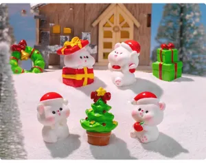 Close-up detail of cute Christmas miniature figurines, resin bear toys, snow scene DIY decor.