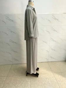 Detail view of the elegant grey cotton linen long sleeve shirt and wide leg pants set.