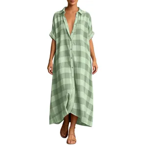 Detailed view of the casual loose green plaid shirt dress featuring lapel and short sleeves.
