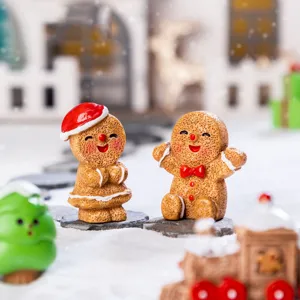 Christmas gingerbread man resin miniature figurines pair for holiday snow scene desktop decor