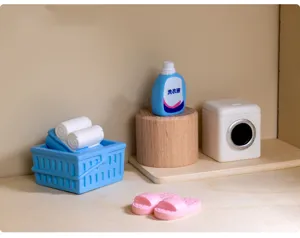 Miniature laundry room decor set, resin washing machine, basket, and detergent details.