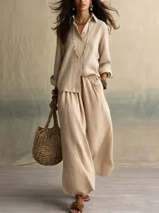 Detailed view of the elegant beige linen blend shirt and wide leg trousers set for women.
