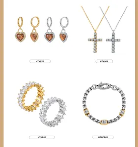 Elegante set de joyería de acero inoxidable con collar de cruz, pendientes de corazón y pulsera.