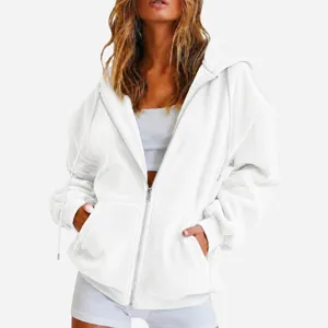 Detail view of the white plush zip-up hoodie featuring a cozy hood, drawstrings, and pockets.
