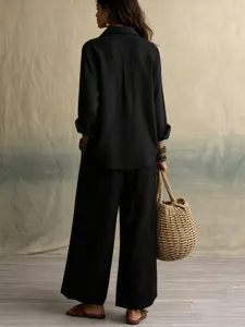 Casual black linen two-piece set, long sleeve shirt and wide leg trousers detail shot.