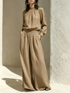 Detailed shot of women casual linen outfit set loose long sleeve top wide leg pants chic style