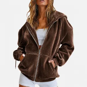 Detailed view of brown velvet zip hoodie featuring soft texture, metal zipper and hood.