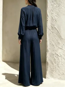 Womens casual cotton linen two piece set featuring a loose long sleeve top and wide leg pants.