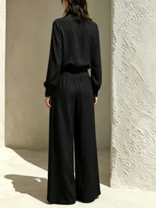 Back detail of casual black long sleeve top and wide leg trousers set for women chic daily wear.