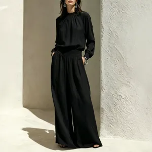 Chic black cotton-linen outfit set with loose top and wide-leg pants for autumn daily wear.