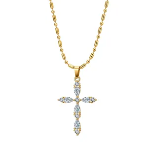 Detailed view of gold stainless steel cross pendant set with sparkling marquise zircons