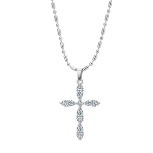 Detail of a sparkling stainless steel cross pendant necklace with marquise zircons