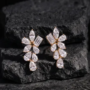 Close-up of geometric 925 silver stud earrings with sparkling marquise and pear cut stones