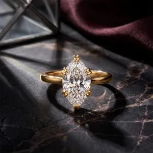 Professionelle Nahaufnahme eines eleganten 1-Karat-Ringes mit Marquise-Diamant in Goldfinish