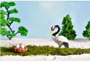 Miniature red-crowned crane figurine for succulent micro landscape photography and decor details.