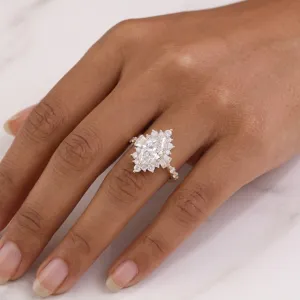 Detailed view of a marquise-cut lab diamond ring on a finger with luxury accents