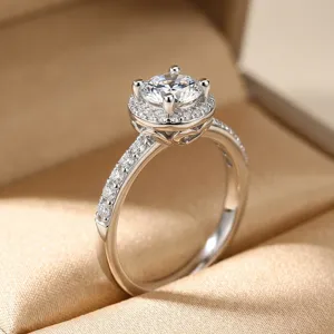 Detailed macro shot of an S925 silver engagement ring with a halo-set moissanite stone