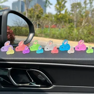 Luminous resin mini rabbit figurines for car dashboard decor, cute glowing toy ornaments.