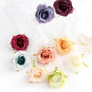 Close-up detail shot of colorful artificial silk rose flower heads for DIY crafts and decor.