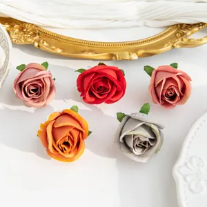 Artificial silk rose flower heads for DIY crafts, wedding decorations, and floral arrangements.