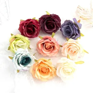 Artificial rose flower heads silk flowers detail shot for DIY crafts and wedding decor.