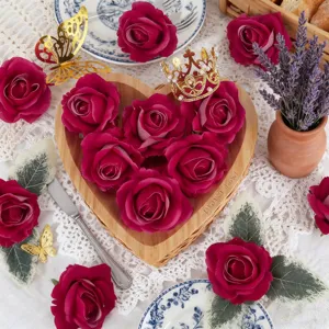 Detailed view of artificial velvet rose flower heads arranged in a heart wooden bowl for decor.