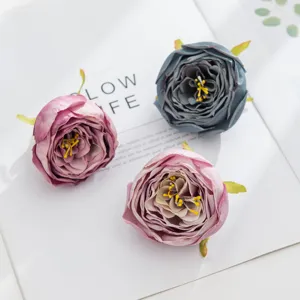 Artificial rose flower heads in grey-blue and pink for DIY crafts, wedding and home decor.