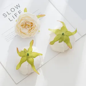 Artificial white rose flower heads for DIY crafts, wedding decor and floral wall arrangements.