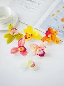 Artificial orchid flowers detail view, realistic film material for cake decoration and headwear craft