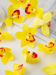 Artificial yellow cymbidium orchid flowers heads for cake dessert table party home decor craft.